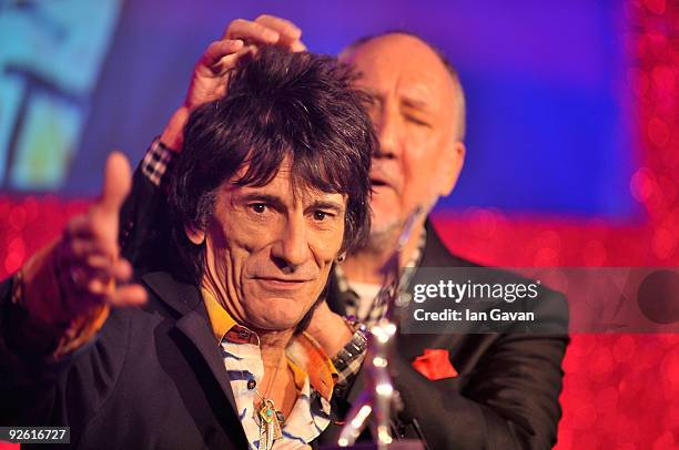 Ronnie Wood from the rock group the Rolling Stones with his Outstanding Contribution award onstage with Pete Townshend during the Classic Rock Roll...