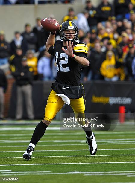 Quarterback Ricky Stanzi of the Iowa Hawkeyes looks for a receiver down field against the Indiana Hoosiers at Kinnick Stadium on October 31, 2009 in...