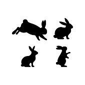 A set of Easter rabbits silhouette in different shapes and actions