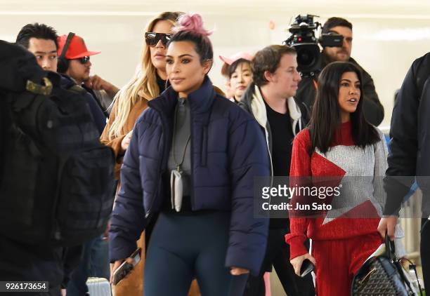 Kim Kardashian, Kourtney Kardashian and Khloe Kardashian are seen upon arrival at Tokyo Station on March 2, 2018 in Tokyo, Japan.