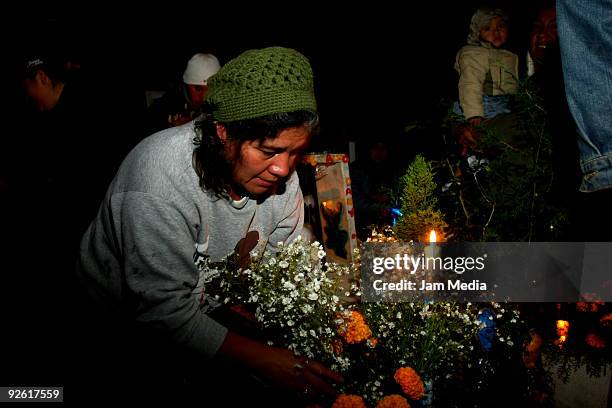 Faithful celebrate the Dia de los Muertos' at the Xilotepec cemetery on November 1, 2009 in Xochimilco, Mexico. Once a year, the Cemetery Xilotepec...