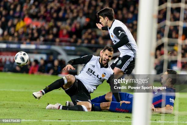 Luis Suarez of FC Barcelona trips up with Martin Montoya Torralbo of Valencia CF during the Copa Del Rey 2017-18 match between FC Barcelona and...