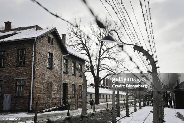 Barbed wire surrounds the former prison camp at the Auscwitz-Birkenau concentration camp museum in Auscwitz-Birkenau, Poland, on Wednesday, Feb. 28,...