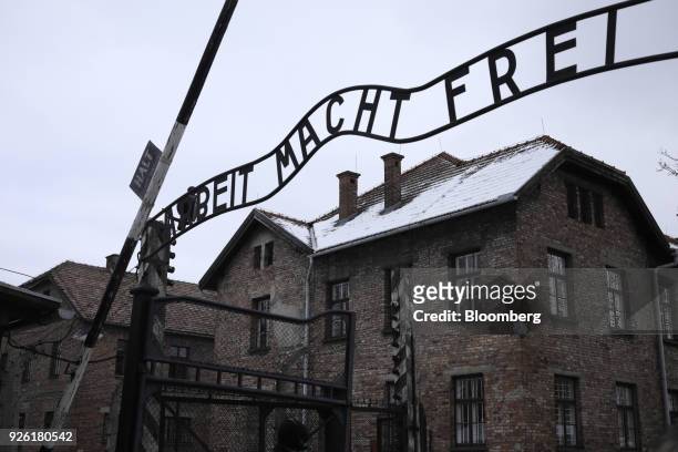 An inscription 'Arbeit Macht Frei' sits above the main gate at the Auscwitz-Birkenau concentration camp museum in Auscwitz-Birkenau, Poland, on...