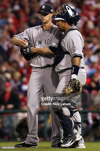 Burnett and Jose Molina of the New York Yankees talk in the bottom of the first inning against the Philadelphia Phillies in Game Five of the 2009 MLB...