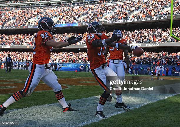 Charles Tillman of the Chicago Bears celebarates an interception and a touchdown run with Hunter Hillenmeyer and Mark Anderson against the Cleveland...