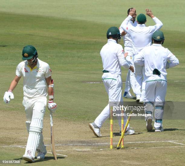 Pat Cummins of Australia bowled by Keshav Maharaj of the Proteas during day 2 of the 1st Sunfoil Test match between South Africa and Australia at...