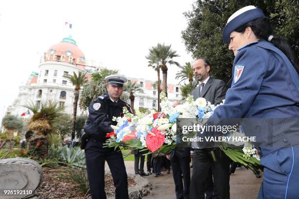 French Prime minister Edouard Philippe lays a wreath of flowers during a tribute to the victims of 2016 Bastille Day attack on March 2, 2018 in the...