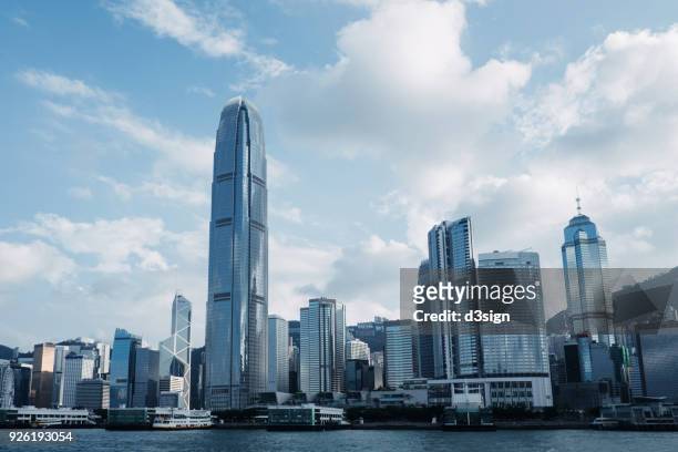 concrete jungle of hong kong cityscape and modern skyscrapers in central business district - commercial buildings hong kong morning stock pictures, royalty-free photos & images