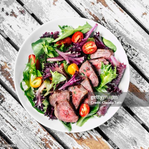 steak with salad - steak plate stock pictures, royalty-free photos & images