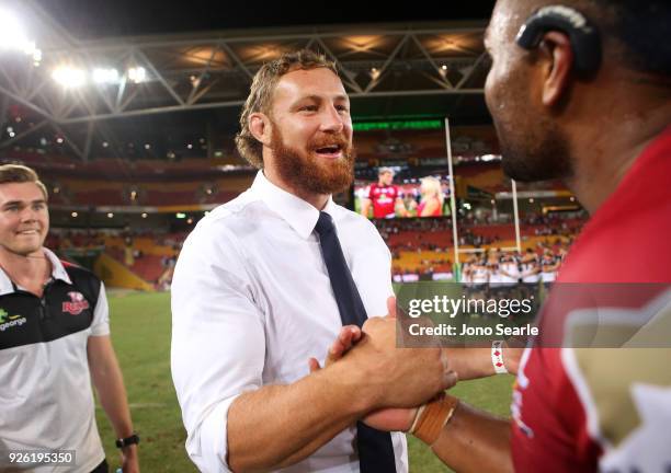 Suspended Reds Captain Scott Higginbotham celebrates his teams win during round two of the Super Rugby match between the Reds and the Brumbies at...