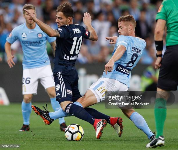James Troisi of the Victory and Oliver Bozanic of Melbourne City contest ther ball during the round 22 A-League match between Melbourne City FC and...