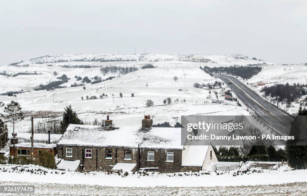 Farm house in the snow next to the M62 in Kirklees, after a section of the motorway was closed, as the severe weather conditions continue.