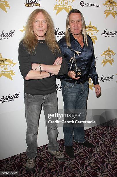 Janick Gers and Nicko McBrain from the rock group Iron Maiden with their Band of the Year award during the Classic Rock Roll Of Honour Awards at the...