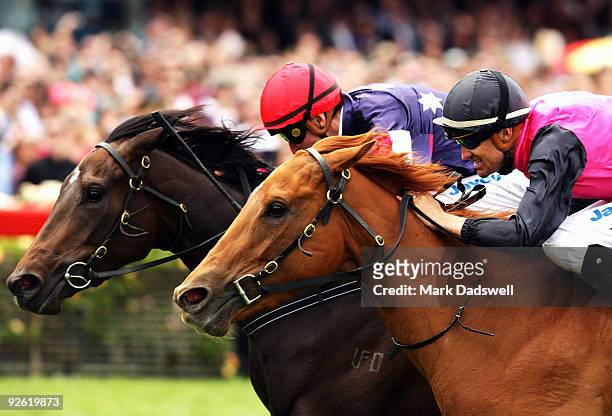 Jockey Steven Arnold riding Majestic Music wins the Lexus Hybrid Plate from Dwayne Dunn riding Europa Point during the 2009 Melbourne Cup Day meeting...