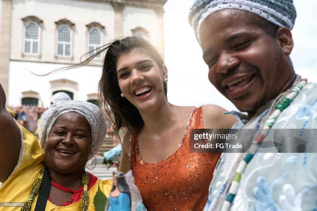 Tourist Woman Taking a Selfie With Local Brazilian Religious People