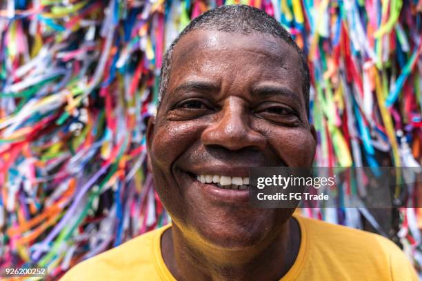 portrait of a latino man smiling - salvador bahia stock pictures, royalty-free photos & images