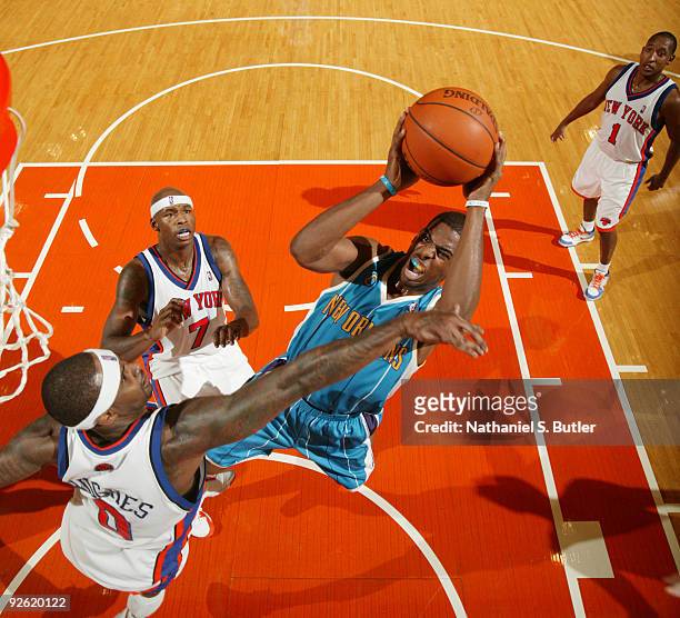 Chris Paul of the New Orleans Hornets shoots against Larry Hughes of the New York Knicks on November 2, 2009 at Madison Square Garden in New York...