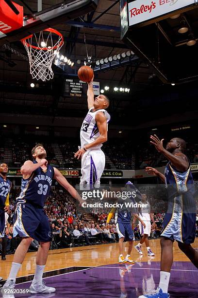 Kevin Martin of the Sacramento Kings drives to the basket for a dunk against Marc Gasol of the Memphis Grizzies on November 2, 2009 at ARCO Arena in...