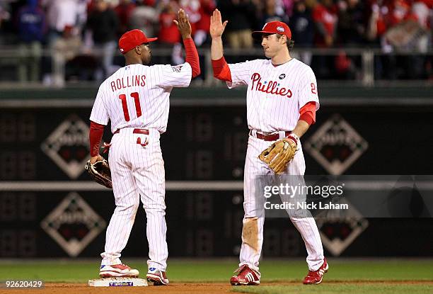 Jimmy Rollins and Chase Utley of the Philadelphia Phillies celebrate their 8-6 win against the New York Yankees in Game Five of the 2009 MLB World...