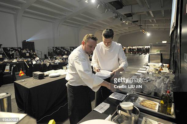 To go with story Lifestyle-China-Spain-food-gastronomy by Pascale Trouillaud Spanish chef Albert Adria and his assistant prepares for a demonstration...