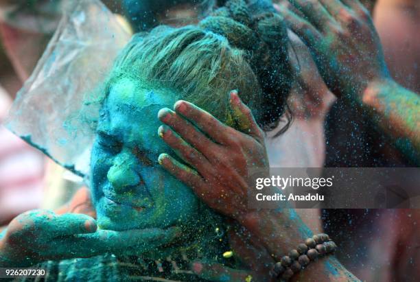 An Indian girl's face is smeared in color as she celebrates Holi, the Hindu festival of colors, in Mumbai, India on March 02, 2018. The festival, a...