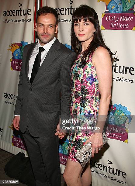 Jonny Lee Miller and Michelle Hicks walk the red carpet at the 10th Anniversary celebration of Only Make Believe at the Shubert Theatre on November...