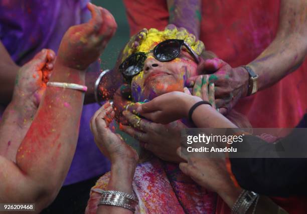 An Indian girl's face is smeared in color as she celebrates Holi, the Hindu festival of colors, in Mumbai, India on March 02, 2018. The festival, a...