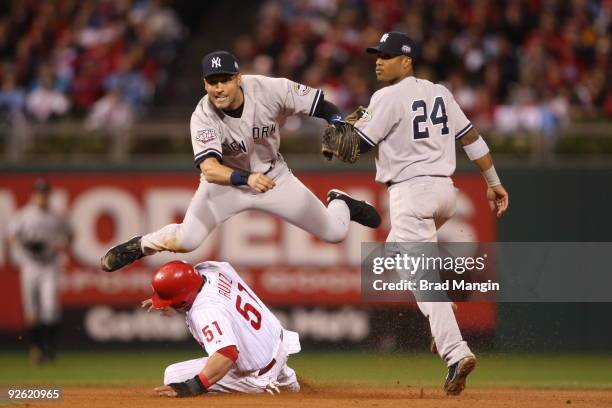 Derek Jeter of the New York Yankees turns a double play in the bottom of the eighth inning of Game Five of the 2009 MLB World Series at Citizens Bank...