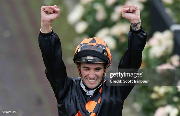 Jockey Corey Brown celebrates after riding Shocking to victory in the Emirates Melbourne Cup during the 2009 Melbourne Cup Day meeting at Flemington...