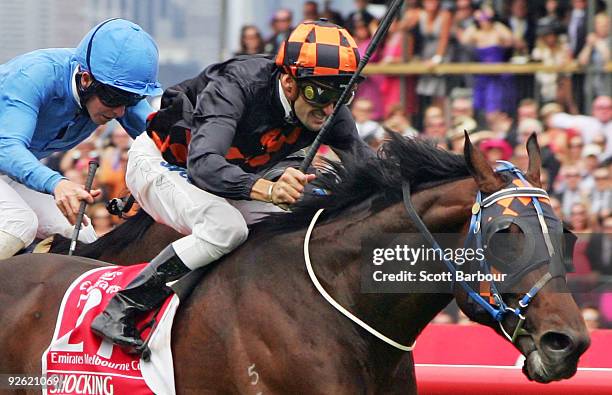 Jockey Corey Brown riding Shocking wins the Emirates Melbourne Cup ahead of Kerrin McEvoy riding Crime Scene during the 2009 Melbourne Cup Day...