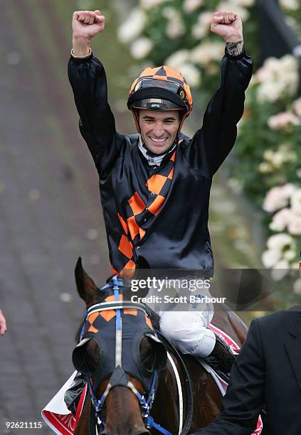 Jockey Corey Brown celebrates after riding Shocking to win the Emirates Melbourne Cup during the 2009 Melbourne Cup Day meeting at Flemington...