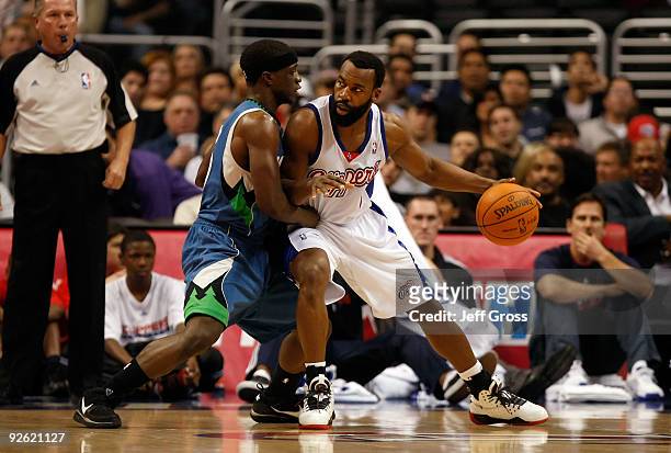 Baron Davis of the Los Angeles Clippers is defended by Jonny Flynn of the Minnesota Timberwolves during the first half at Staples Center on November...