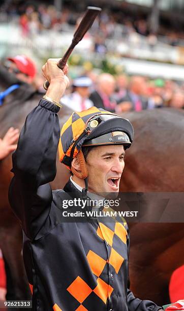 Jockey Corey Brown celebrates after winning the Melbourne Cup on his horse Shocking on November 3, 2009. Shocking denied international contenders...