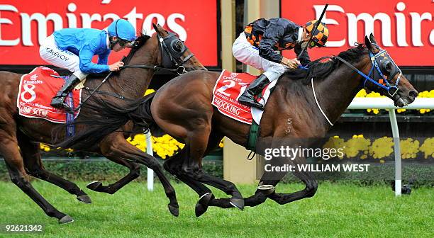 Jockey Corey Brown powers to victory in the Melbourne Cup on his horse Shocking ahead of Kerrin McEvoy on Crime Scene on November 3, 2009. Shocking...