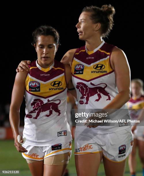 Ally Anderson and Brittany Gibson of the Lions look dejected after a loss during the 2018 AFLW Round 05 match between the Melbourne Demons and the...