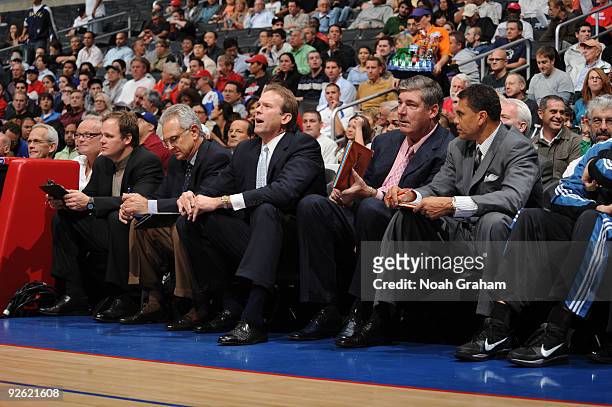 Assistant coach Dave Wohl, head coach Kurt Rambis, and assistant coaches Bill Laimbeer and Reggie Theus of the Minnesota Timberwolves sit on the...