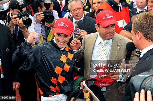 Jockey Corey Brown and trainer Mark Kavanagh celebrate their victory in the Melbourne Cup on their horse Shocking on November 3, 2009. Shocking...