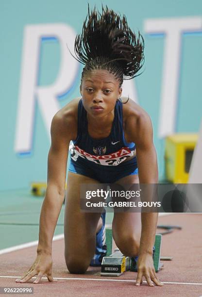 Allyson Felix of the US prepares to leave the starting block in heat three of the women's 200m quarter-final 26 August 2003 during the 9th IAAF World...