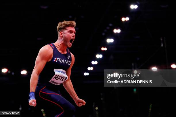 France's Kevin Mayer reacts after a throw in the men's shot put heptathlon event at the 2018 IAAF World Indoor Athletics Championships at the Arena...