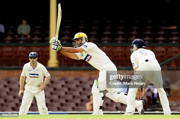 Theo Doropoulos of the Warriors hits out during day one of the Sheffield Shield match between the New South Wales Blues and the Western Australian...