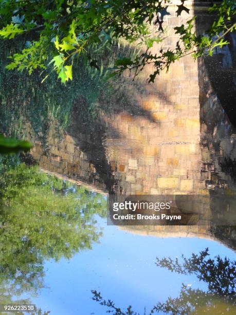 reflections in a still water stream. - brooke payne stock pictures, royalty-free photos & images
