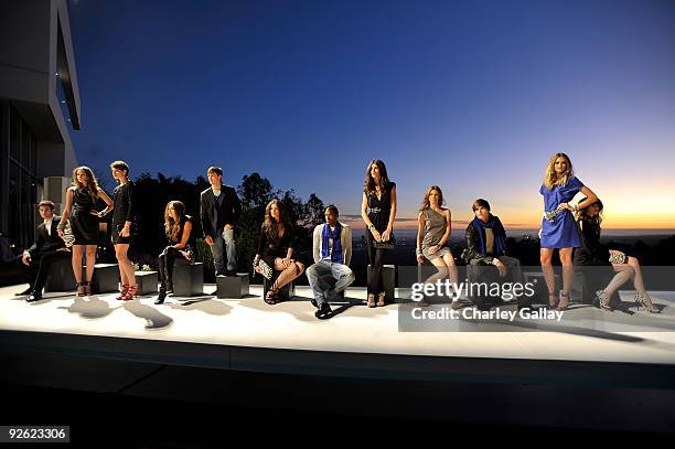 Models pose during the Jimmy Choo for H&M Collection private event in support of the Motion Picture & Television Fund on November 2, 2009 in West...