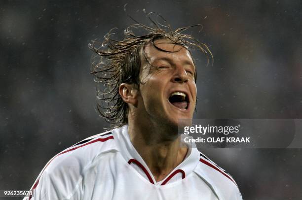 Massimo Ambrosini of AC Milan jubilates after he scored the one goal they needed to pass on to the final during the Champion's league semi-final...