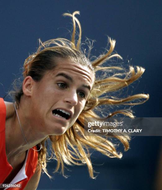 Top-seed Amelie Mauresmo of France serves against number three seed Maria Sharapova of Russia during their 2006 US Open semi-final at the USTA...