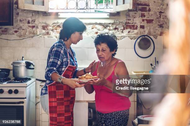 Multi-generation Cuban Family preparing dinner