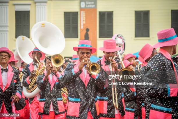 marching past the slavery museum - cape town carnival in south africa stock pictures, royalty-free photos & images