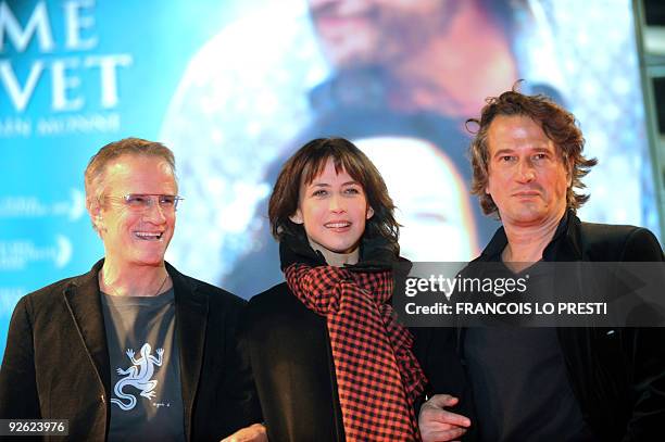 French actor Christophe Lambert , French actress Sophie Marceau and French film director Alain Monne pose on November 02, 2009 in Lomme northern...