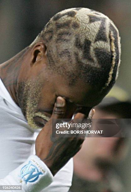 Marseille's forward Djibril Cisse reacts at the end of the French L1 football match against Monaco, 09 December 2006 at the velodrome stadium in...