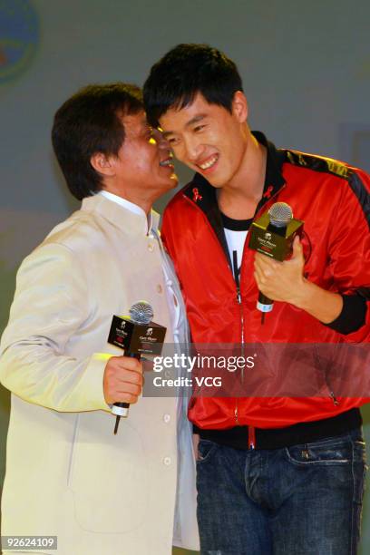 Movie star Jackie Chan and Chinese 110 meter hurdler Liu Xiang attend a charity party of 'Hand in Hand, Heart to Heart' on November 2, 2009 in...